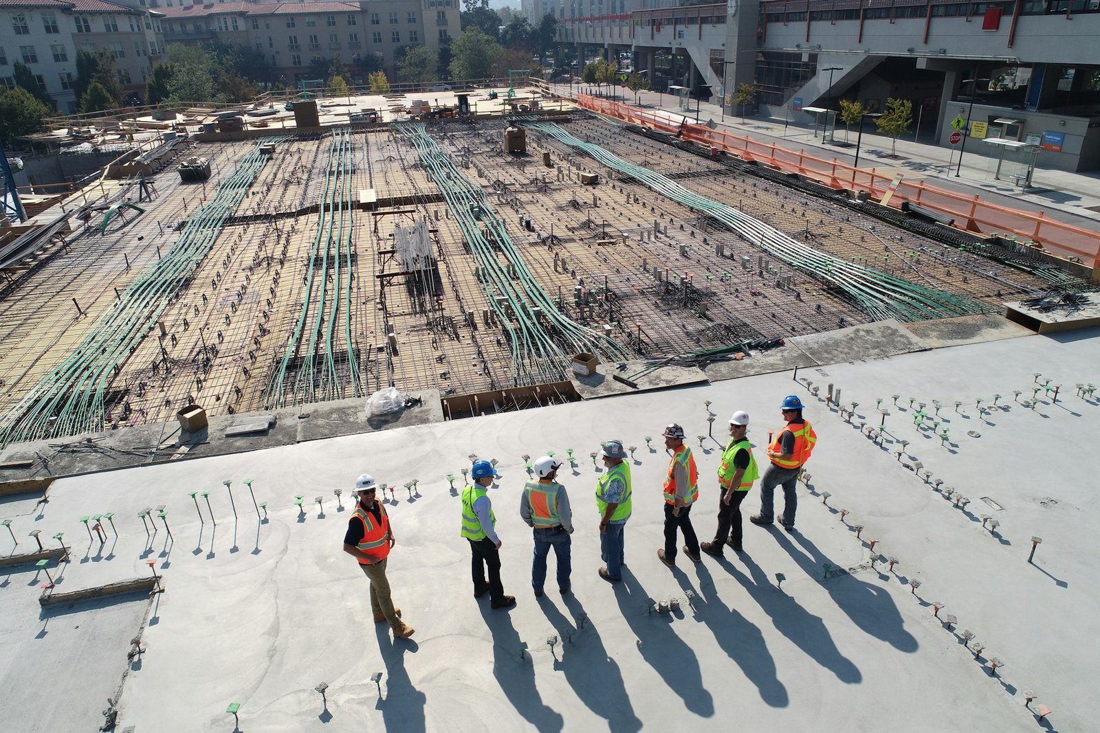 Construction crew working on a site under blue sky